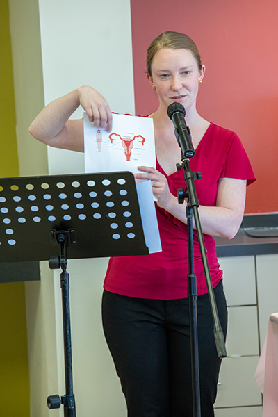 Guest speaker presents at "Period Positivity" party. 