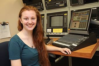 Eastern graduate and CECE research assistant Stefanie Dominguez ’17 sits in front of the remote video recording technology she used to conduct research for her honors thesis.