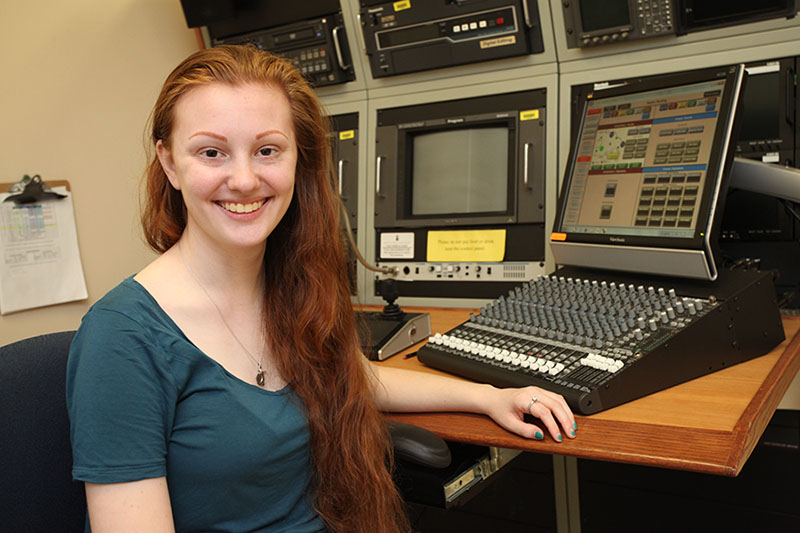 Eastern graduate and CECE research assistant Stefanie Dominguez ’17 sits in front of the remote video recording technology she used to conduct research for her honors thesis, documented in the CECE video “A Study of the Play of Dual Language Learners in an English-Speaking Classroom.”