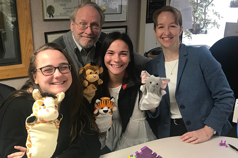 Student researchers Allison Lundy ’20 and Alyssa Barry ’20 pose with Professor Jeffrey Trawick-Smith and CECE researcher Julia DeLapp after being interviewed on WILI’s Wayne Norman show about the TIMPANI Toy Study, which was featured in the CECE video “TIMPANI Toy Study Results 2019.”
