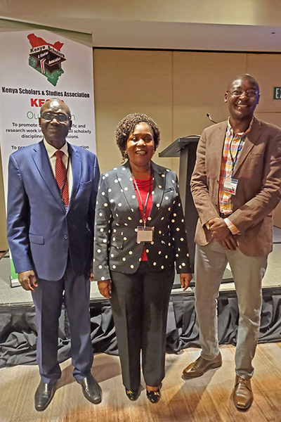 Muchiri with the Kenyan Ambassador to the United States (left), and a member of the Kenyan Parliament (center) at the Kenya Scholars & Studies Association conference this year