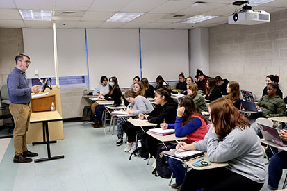 An Eastern professor teaches a course.