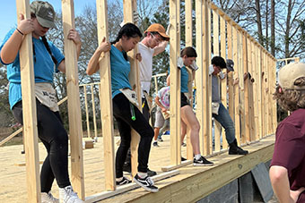 Habitat for Humanity students work on building house