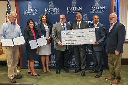The Liberty Bank Foundation donates a $25,000 check to Eastern's business incubator.