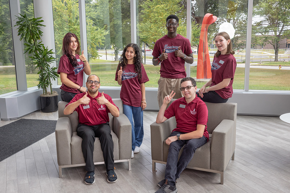 A group of RA's pose with Housing staff