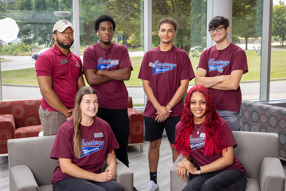 Residential Life Coordinator Emmanuel Augustin with five RAs