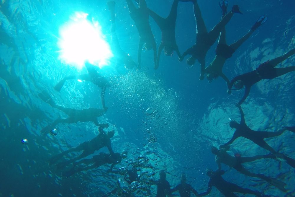 Students enjoy oceanic research while snorkeling in the Bahamas.