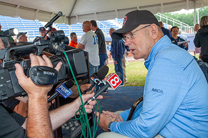Coach Bill Holowaty speaks with the media at the naming of Holowaty Family Field.