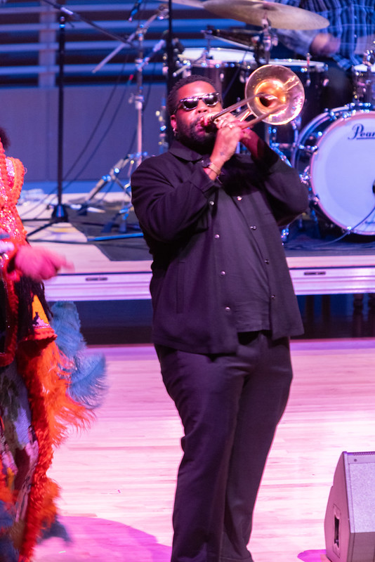 A trombonist onstage at "Take Me to the River All Stars"