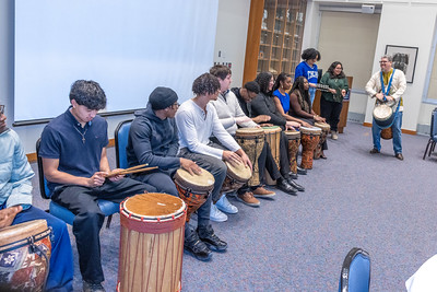 Leonard Epps leads the audience in a drum circle.