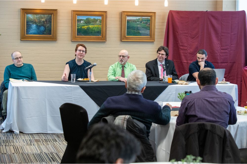 Faculty members, including Nicolas Simon (second from right), participate in a "lunch and learn" panel during OEWeek.