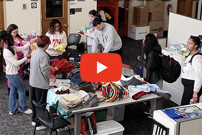 Thrift Warriors volunteers sort through recently donated goods.