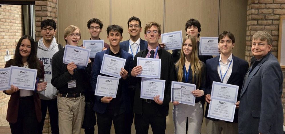 Eastern's BIS-ITSA Club shows off their winning certificates.