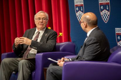 Richard Detweiler (left) speaks with President Karim Ismaili.
