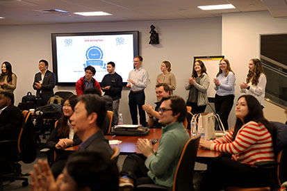 Audience members give a round of applause.