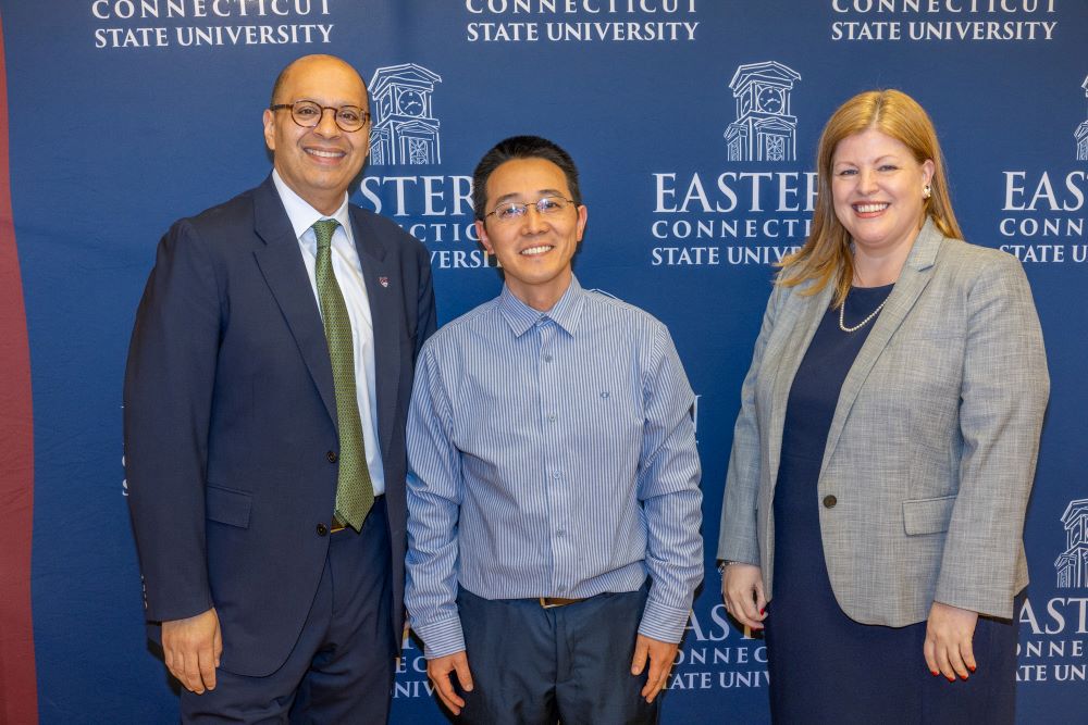From left: President Karim Ismaili, Professor Xing Liu, and Provost Cheryl Wilson