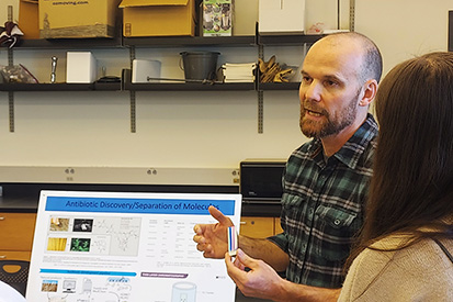 Biology Professor Jonathan Hulvey participates in a lab demonstration at Tiny Earth Day.