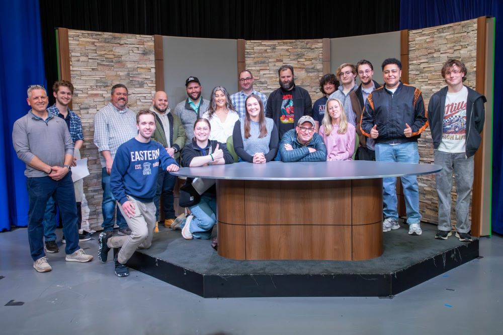 Alumni pictured include Kevin Gilbert ‘03, Eric Larson ‘98, Chris Cruz ‘25, Jared Tofil ‘25, Julia Florence ‘22, Caroline Smith ‘20, Griffen Mansfield ‘21, Griffin Davis ’25, Anthony Giordano ‘10, Megan Saunders ‘15, Nick Zeni ‘12, Daphne Beckers ‘12, John Zorzi ‘11, Jeffry Langan ‘11, and Shawn McGuigan ‘24.