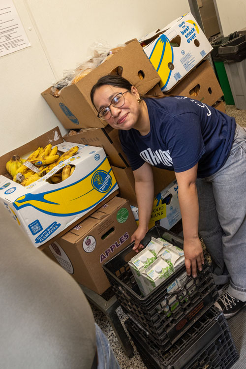Summer Civic Leadership Program student assisting with loading and distribution of goods.