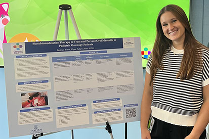 Sierra presenting "Photobiomodulation Therapy to Treat and Prevent Oral Mucositis in Pediatric Oncology Patients."