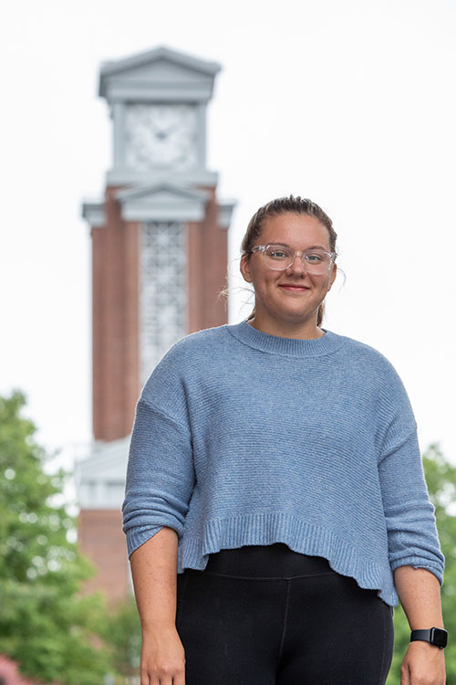 Maebel Haynes in front of Eastern's clock tower.