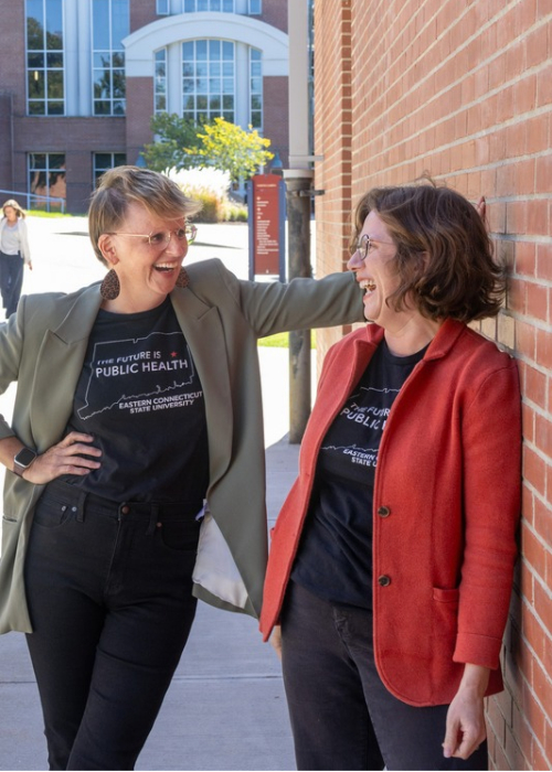 Dr.Sarah Walters and Dr.Sara Carroll pose outside at Eastern Connecticut State University. 