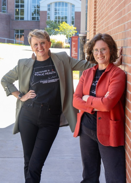Dr. Sarah Walters, assistant professor of public health, left, and Dr. Sara Newman Carroll, associate professor of public health, right, pose together at Eastern Connecticut State University.