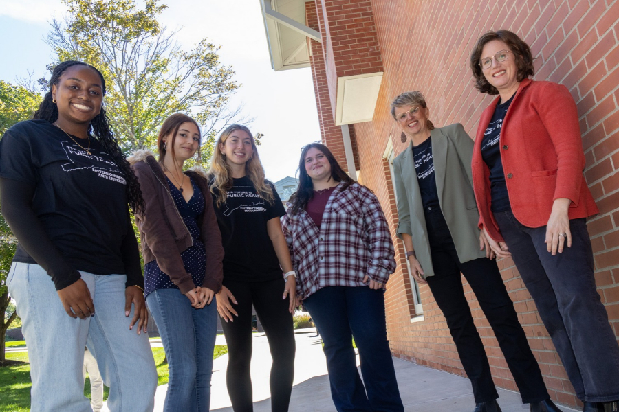 Dr.Sarah Walters and Dr. Sara Newman Carroll pose with students
