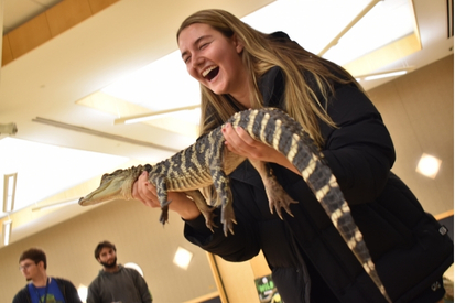 Lauren Lacy '29 holding Spike the American Alligator