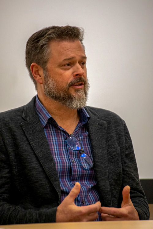 Freeman '93 speaking at a roundtable discussion.