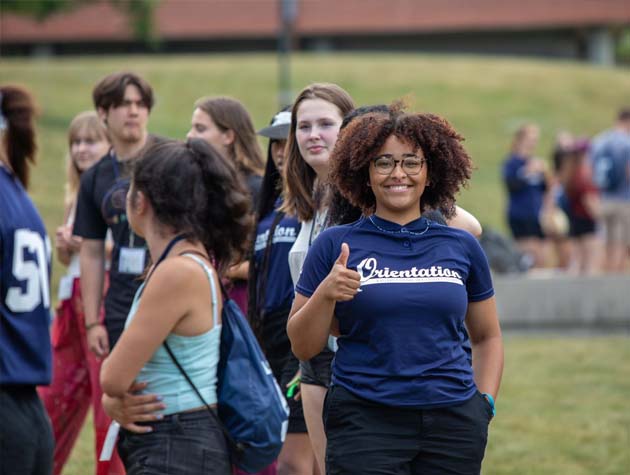 student giving thumbs up