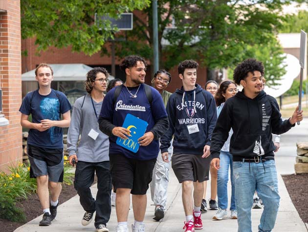 student giving prospective students a tour of campus