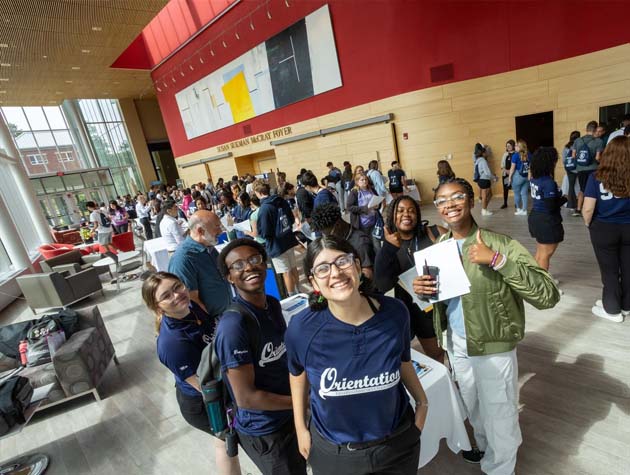 students posing for photo in the Fine Arts building