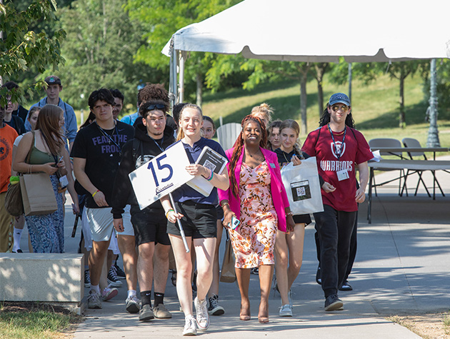 student giving prospective students a tour of campus