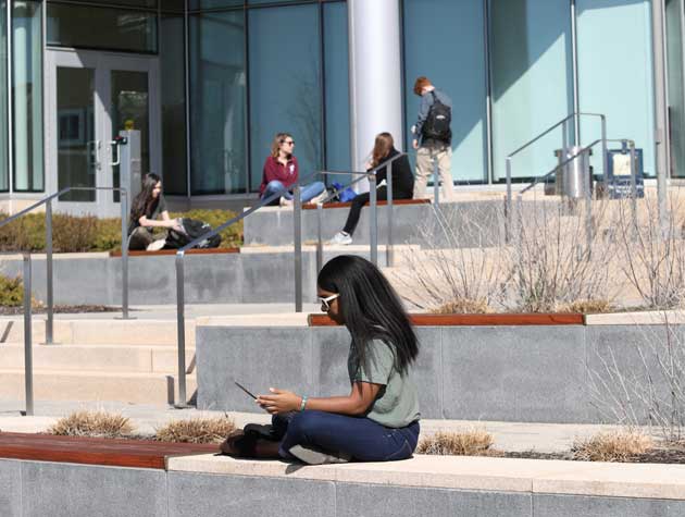 Students relaxing on campus grounds