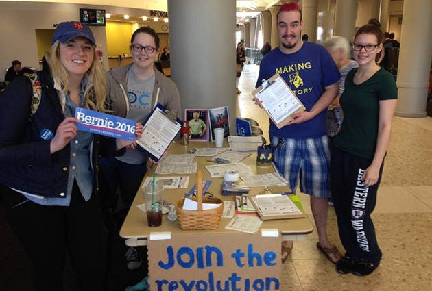 students in the student center campaigning for a presidential candidate