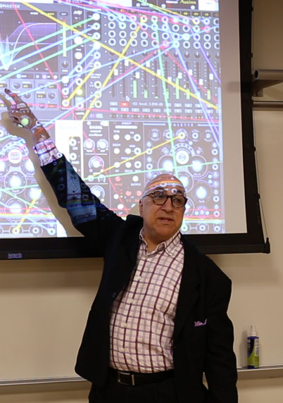 Professor Cornicello in front of a projector screen