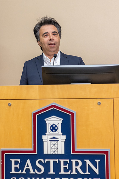 William Lugo speaking during the university meeting