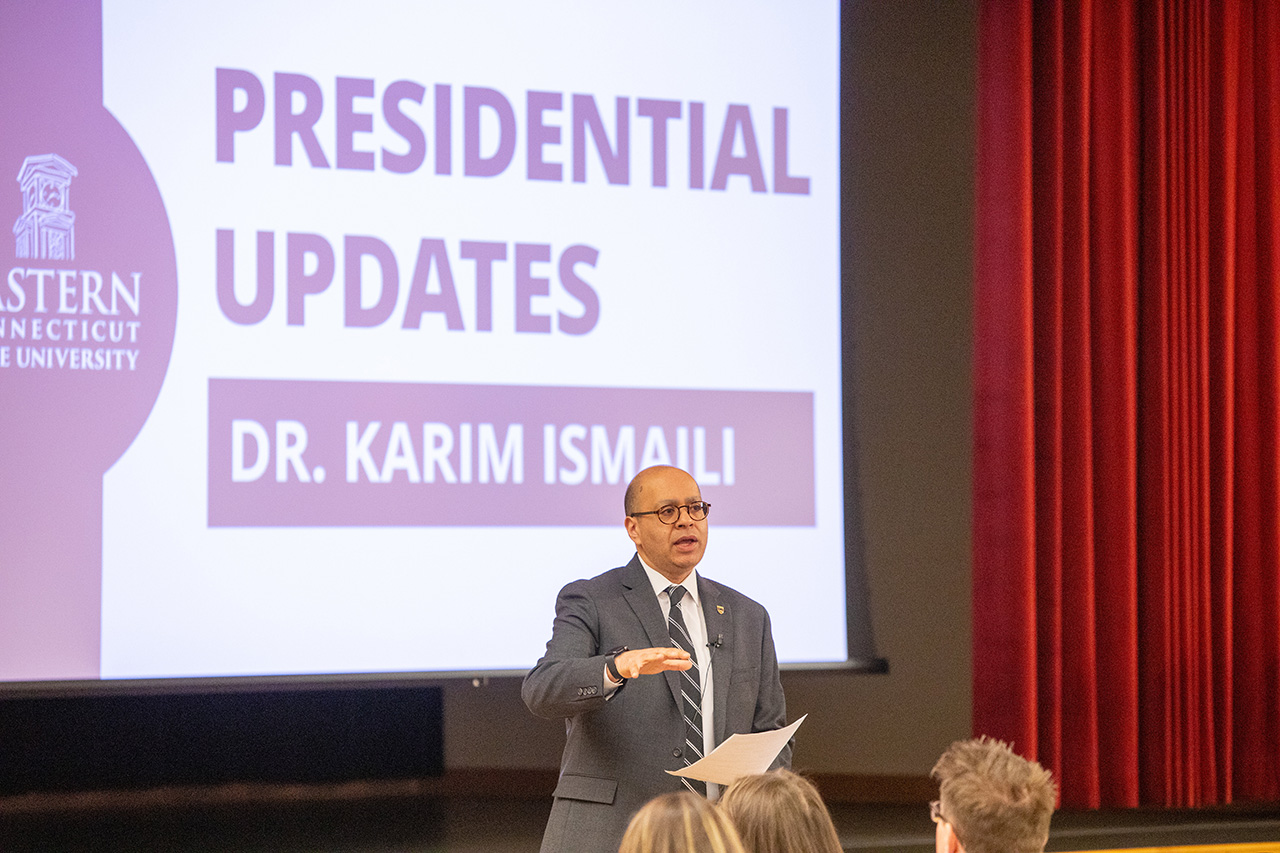 President Karim Ismaili talking during the university meeting