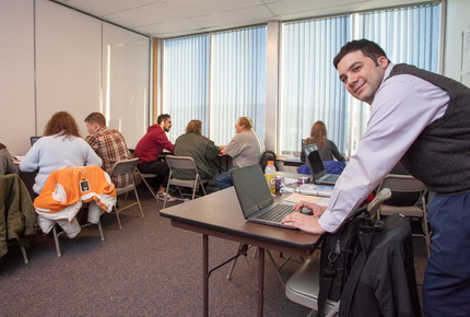 Students assisting people with their taxes