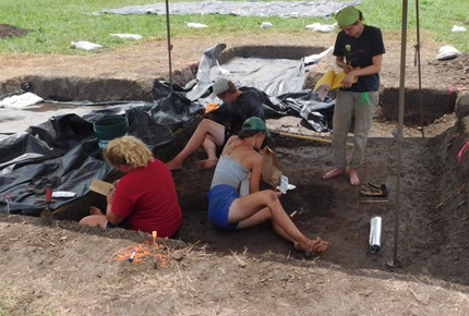 Students working at a dig site