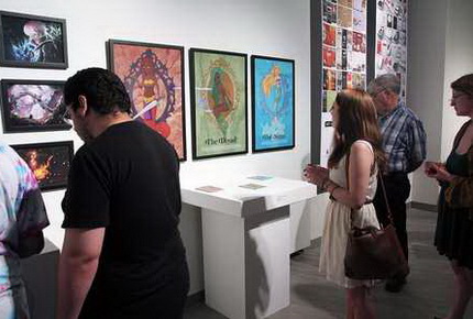 Students and visitors at senior art exhibit