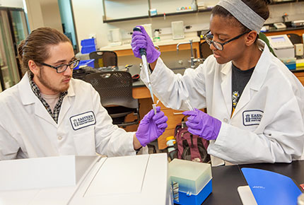 Student using scientific tools