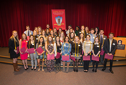 Students from the Lambda Pi Eta honors society