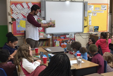 Student teaching elementary school children