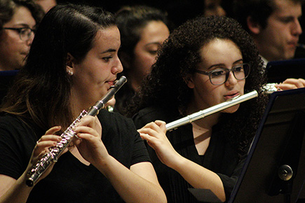 Students playing instruments in ensemble