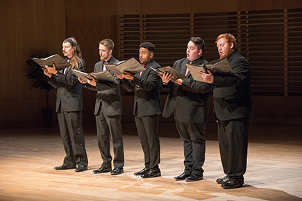 Students singing on stage