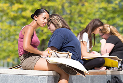 Students drawing outside