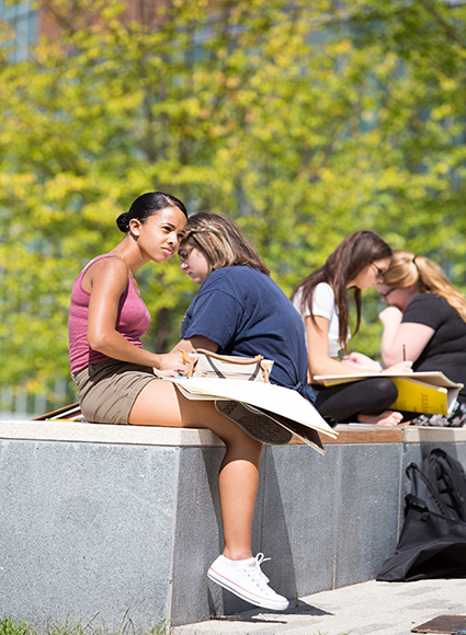 Students drawing outside