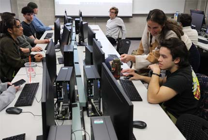 Student and professor at computer